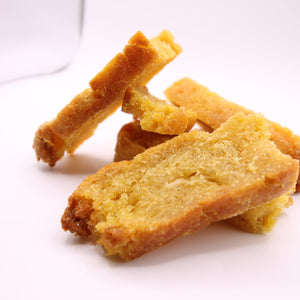 Stack of Daisy Roo Alaskan cod dog treats on a white background