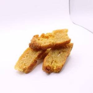 Stack of Daisy Roo Alaskan cod dog treats on a white background